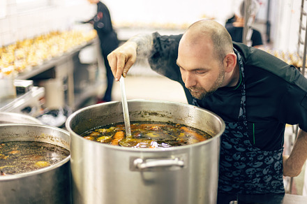 Professional chef carefully tasting, a Photo by Grafvision photography