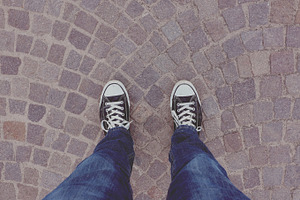 Standing on cobblestone road