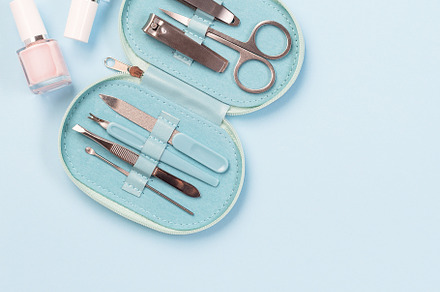 Manicure or pedicure set equipment, on blue background, copy space, top view, s, a Beauty & Fashion Photo by iuliia_n