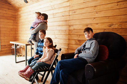 Mother and kids in modern wooden house, spending time together i, a Person Photo by AS photostudio