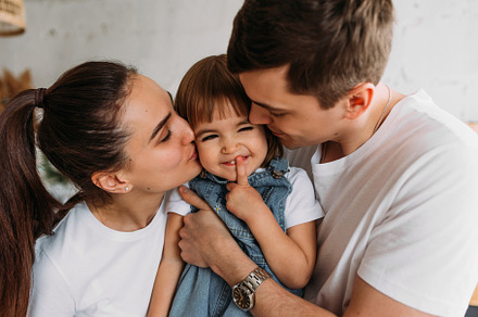 Portrait of a happy young family, a Person Photo by SOTNIKOV_MISHA