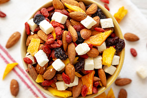 Healthy Dried Fruit and Nut Mix in a Bowl, top view. Close-up., a Food & Drink Photo by LiudmylaChuhunova