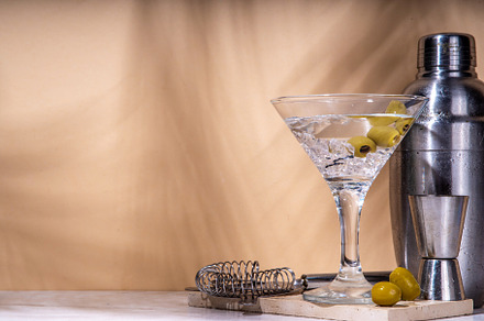 Classic martini cocktail with olive, a Food & Drink Photo by Rimma