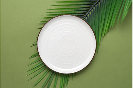 Empty white plate and decorative