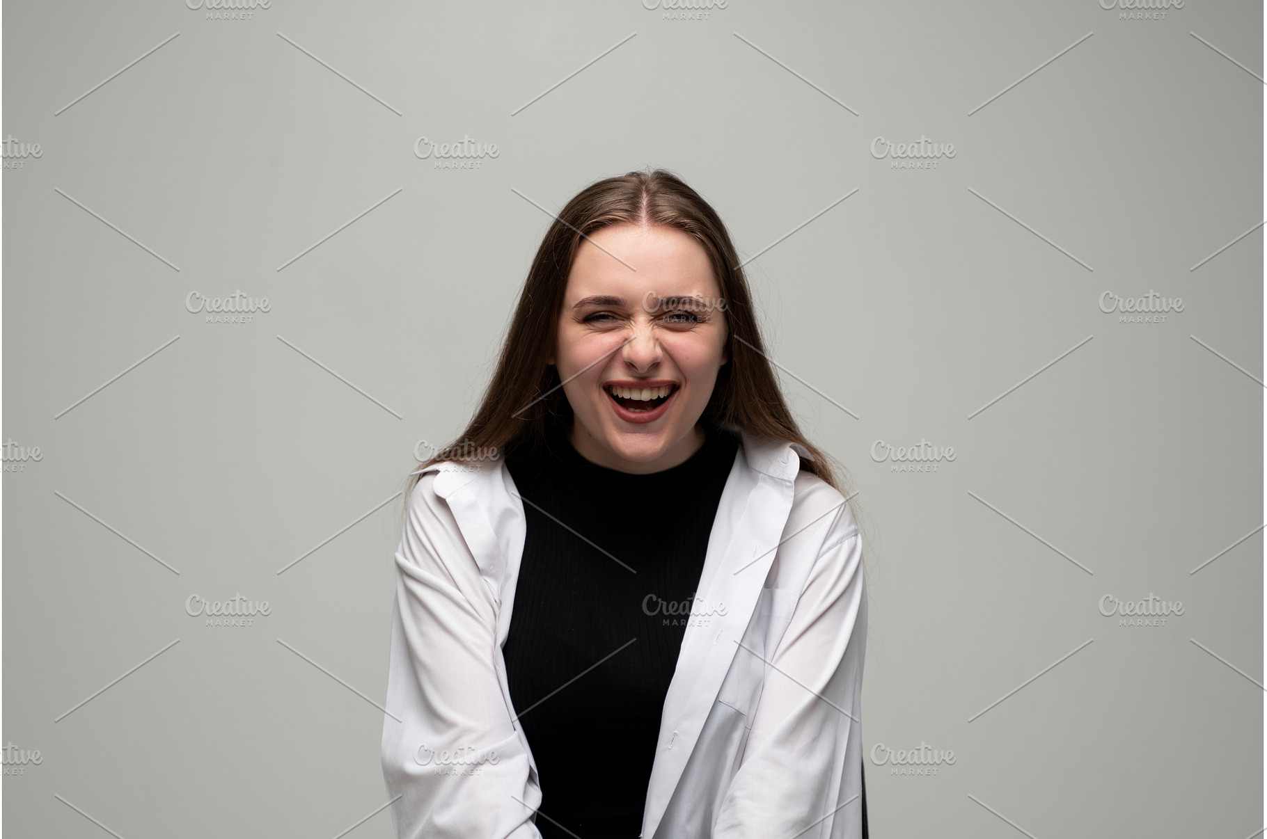 Young woman bursting with laughter, a Person Photo by volodymyrshtun13795