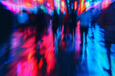 People stroll through a neon-lit urb, a Photo by Tanuart