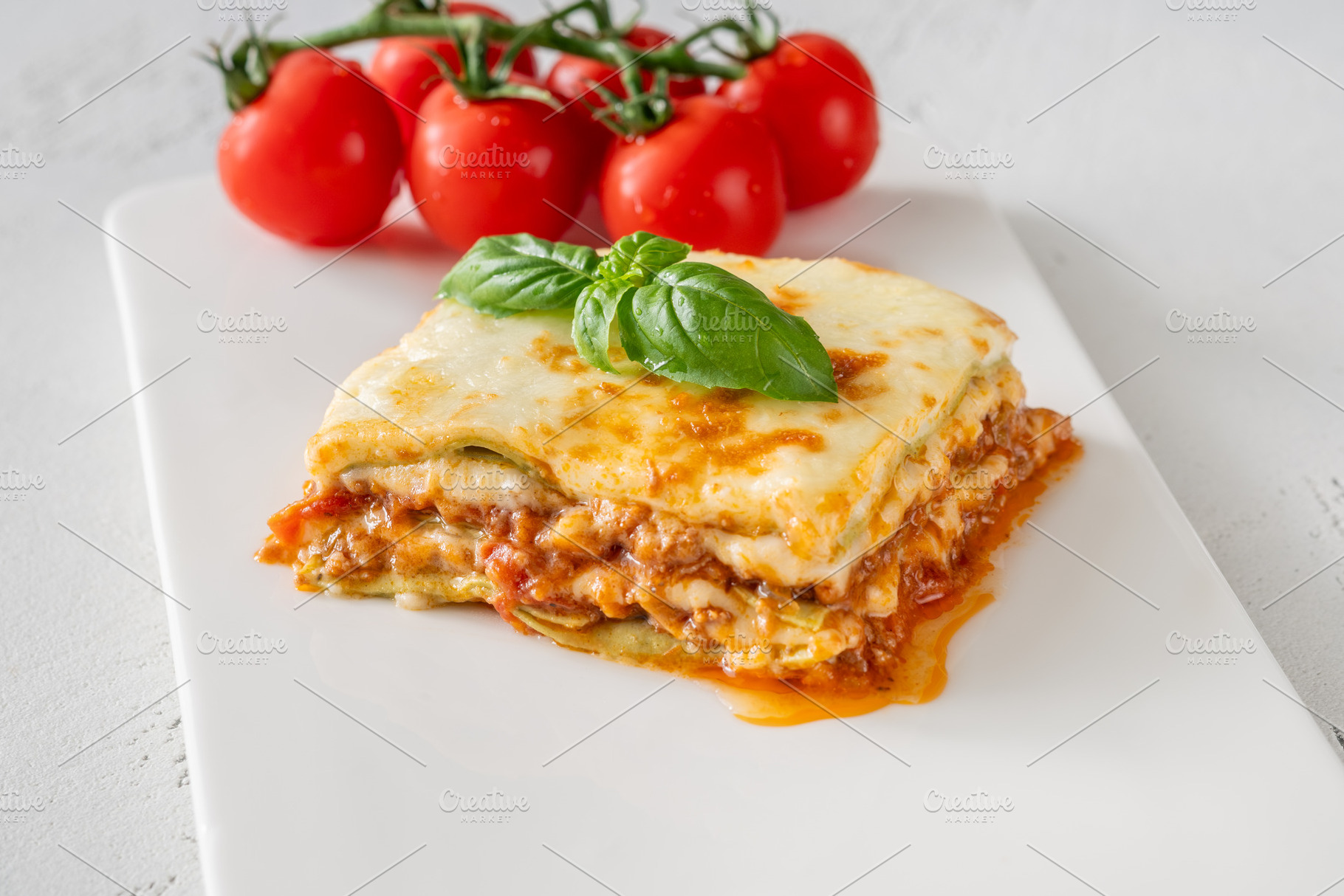 Overhead Lasagna With Golden Mozzarella Basil And Fresh Cherry T, a Food & Drink Photo by Alexander Prokopenko