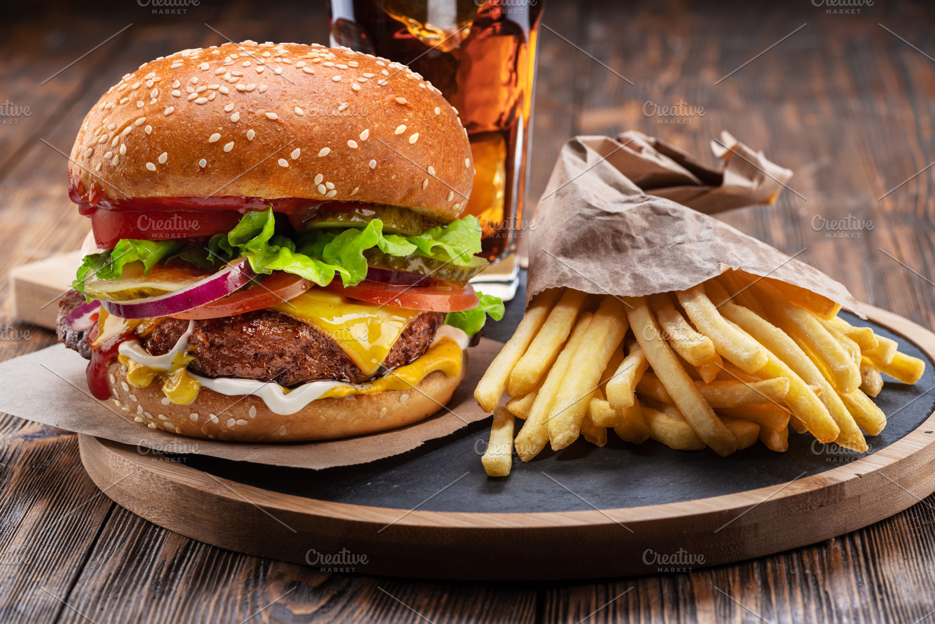 Tasty cheeseburger, glass of cola, a Food & Drink Photo by Volff
