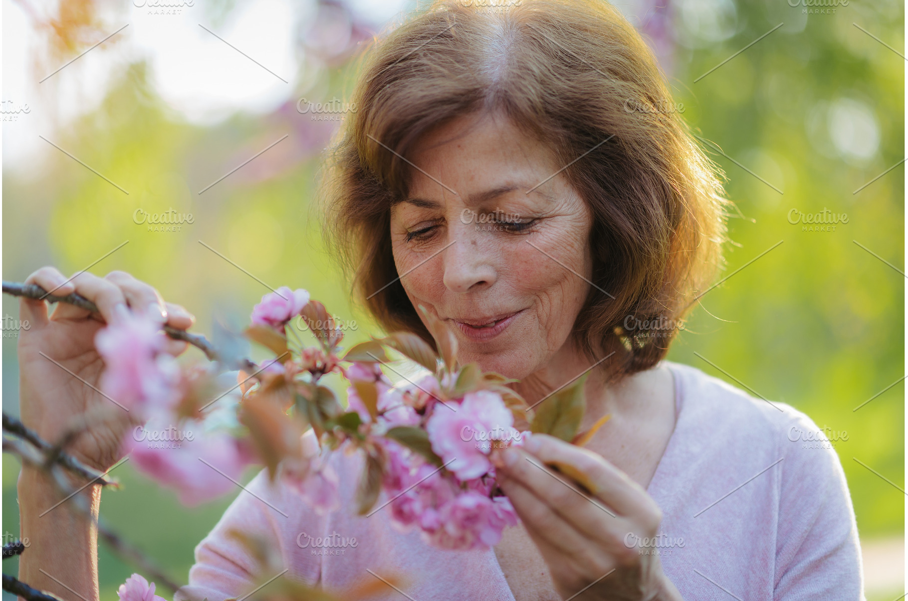 Beautiful senior woman standing, a Person Photo by HalfPoint