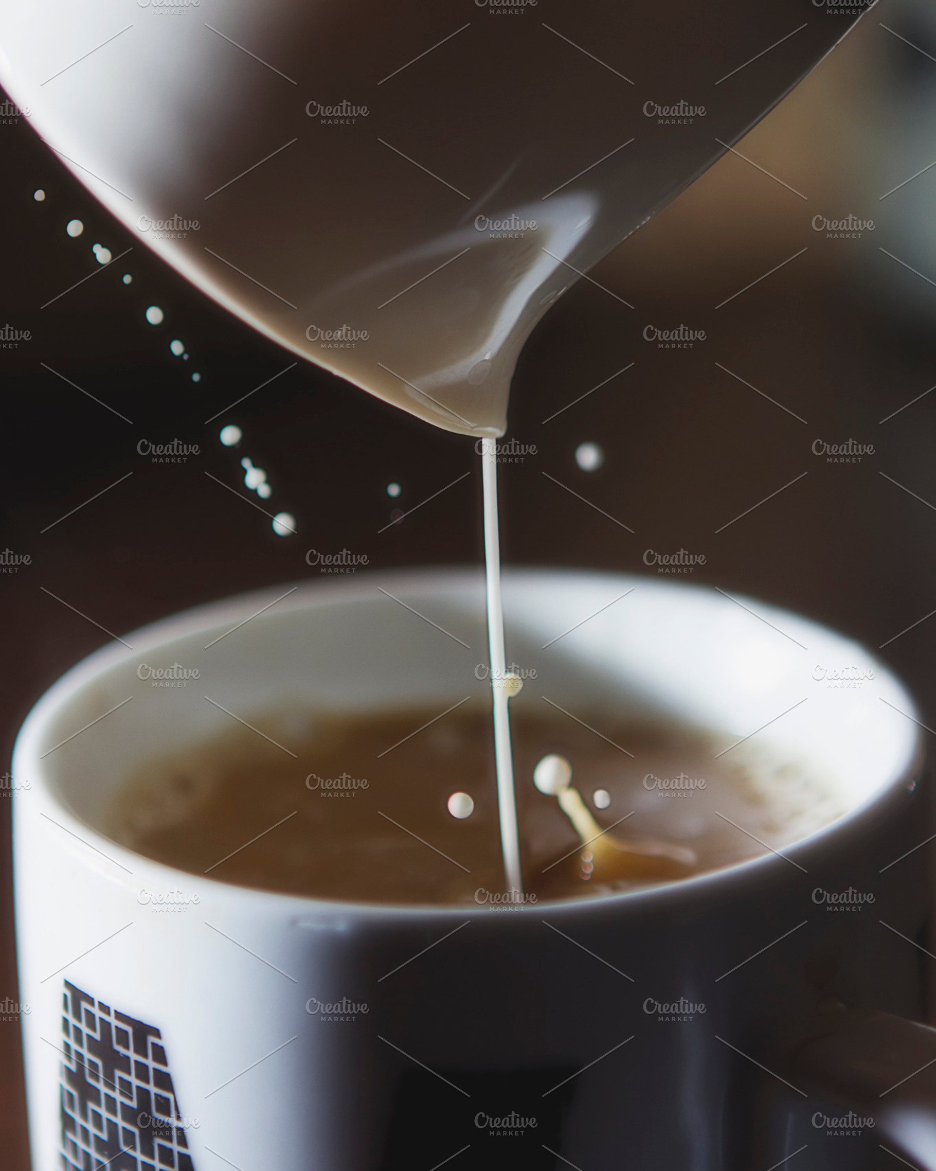 Pouring Creamer Into A Cup Of Coffee