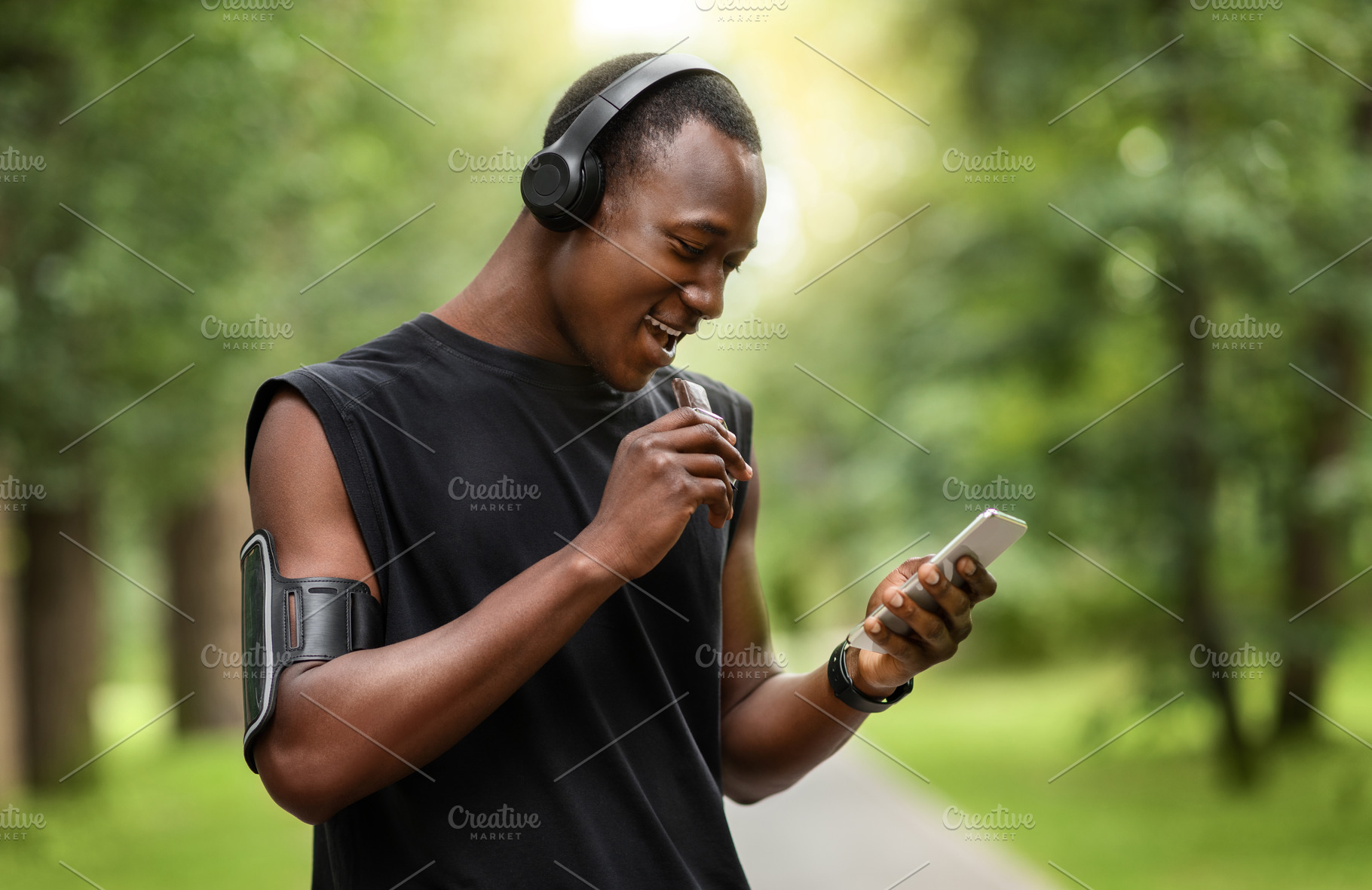 Cheerful african sportsman eating pr, a Photo by Prostock-Studio ...