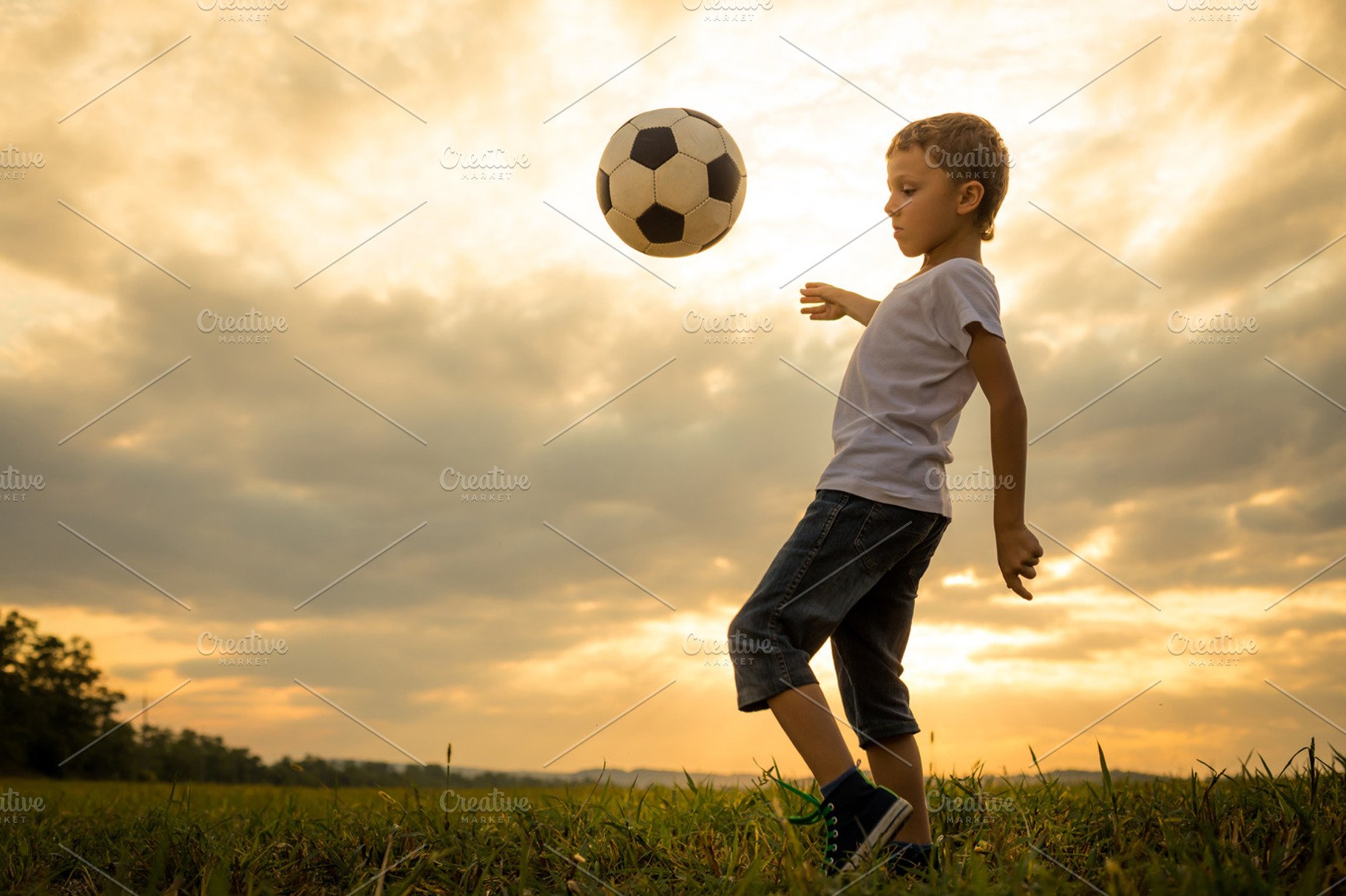 little boy playing in the field, a Sports & Recreation Photo by altanaka