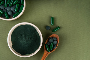 Spirulina in powder, capsules and tablets with spirulina smoothi, a Health & Medical Photo by Rimma