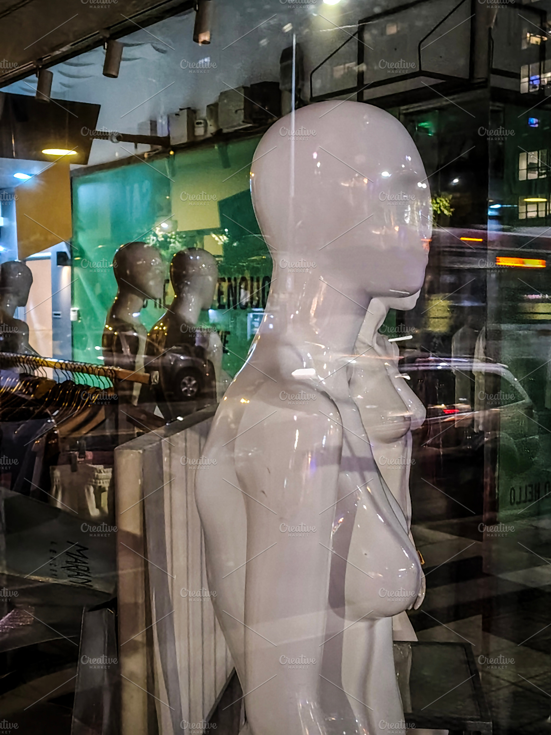 Store mannequin with urban reflections on glass, an Arts & Entertainment Photo by DanFLCreativo