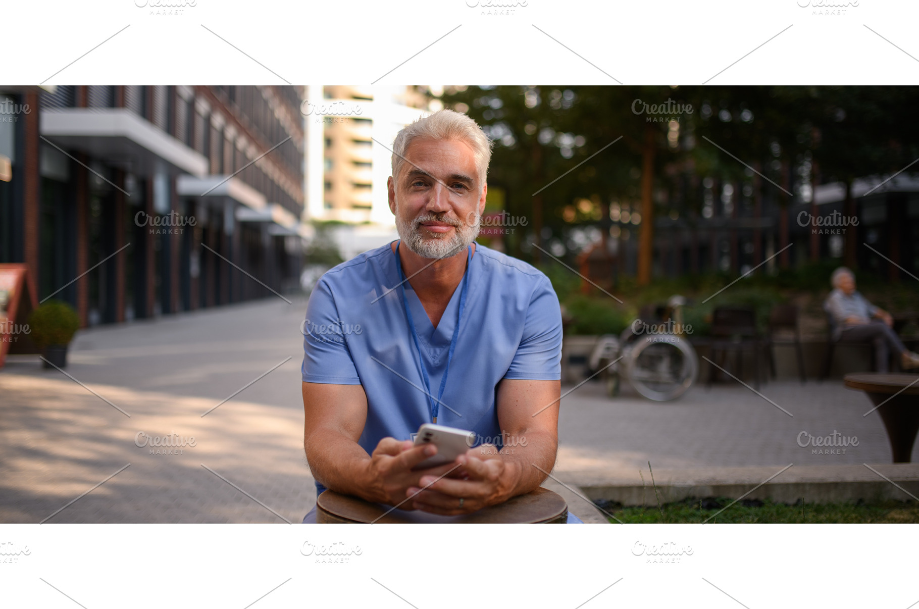 Healthcare worker outside hospital, a Health & Medical Photo by HalfPoint