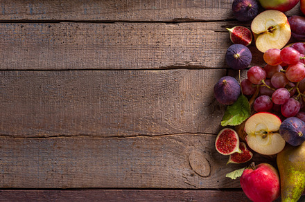 Autumn fruit assortment on wooden background, a Food & Drink Photo by Rimma