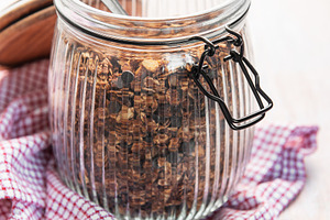 Homemade granola cereal with chocolate chips in jar, a Food & Drink Photo by Olena Rudo