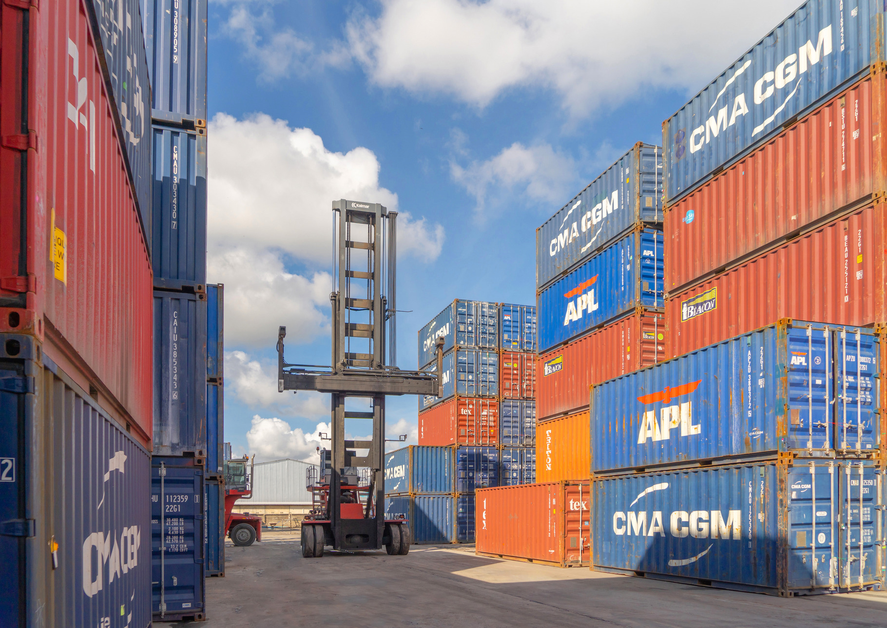 Shipping container site loading by crane in logistic port wareho, an ...