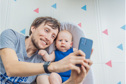 Loving father interacts with his 3