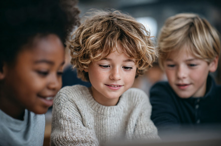 Engaged students collaborate on project in classroom, a School & Education Photo by OSORIOartist