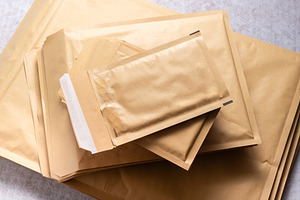 Set of Bubble Mailer Plastic Padded Envelopes in Different Sizes, a Business Photo by MDBildes