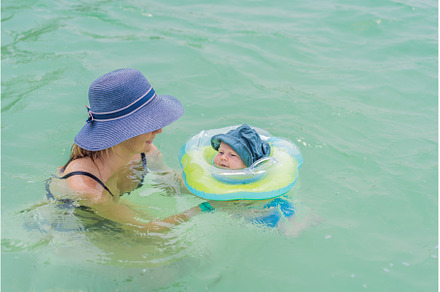 Baby floating in a neck ring in