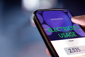 Closeup of Hand Using Home Electric Usage Application to Mornito, a Photo by salmon.black
