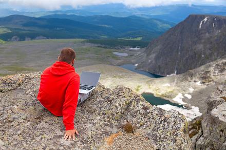 Freelancer works outside the office featuring mountain, man, and view, a Nature Photo by Sova