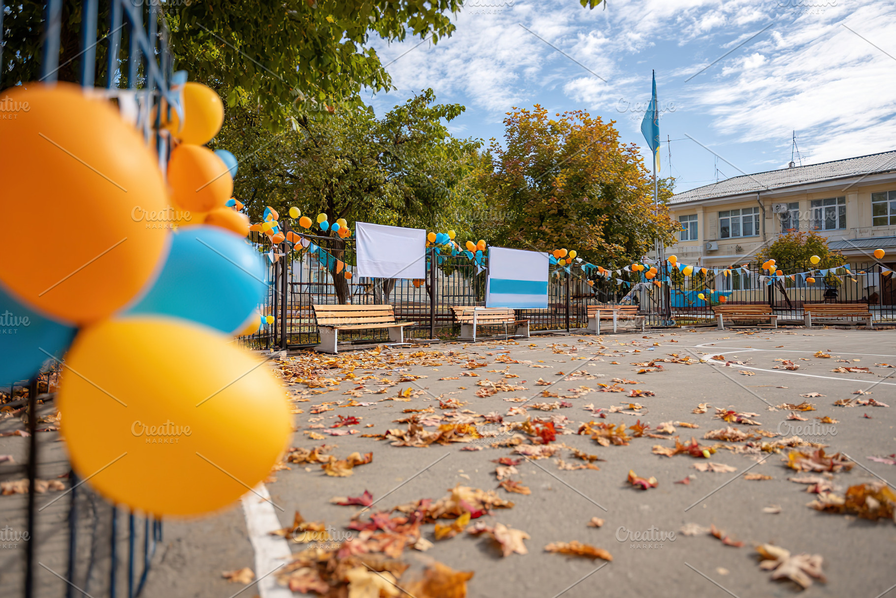 Colorful decorations adorning a playground during a fall celebration in a commu, a Photo by AlyaAnd