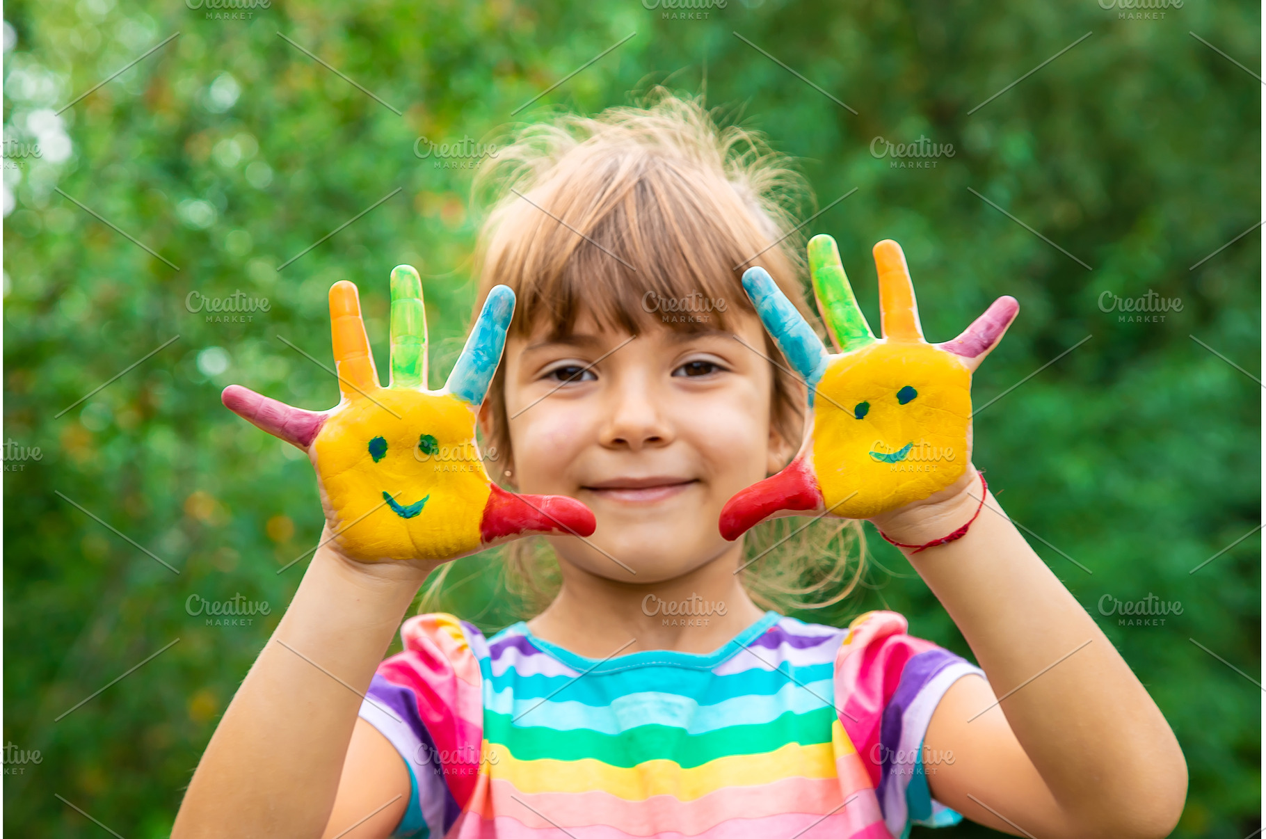 Children's hands with smile paints, an Arts & Entertainment Photo by yanadjana