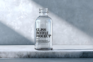 Glass Bottle Mockup, a Product Mockup by GenesisCreativeCo