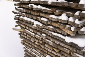 Stacked lumber planks covered in, a Background Photo by volodymyrshtun13795