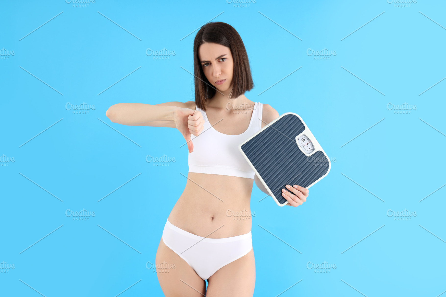 Concept of weight loss with thin girl on blue background, a Person Photo by AtlasStudio