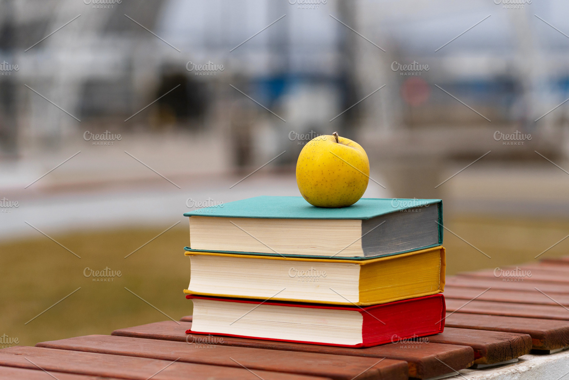 Yellow apple placed atop stack, a School & Education Photo by Elena Vagengeim
