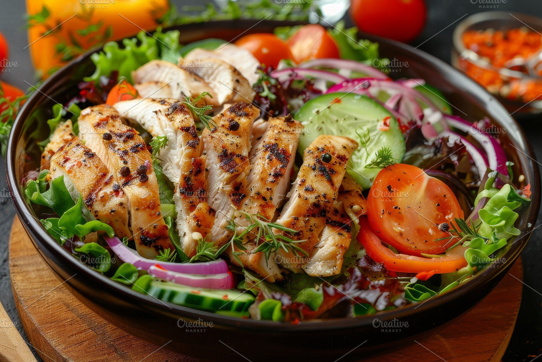 A salad featuring grilled chicken, c, a Photo by Iftikhar Alam
