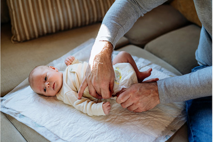 Mature father changing diaper his, a Person Photo by HalfPoint