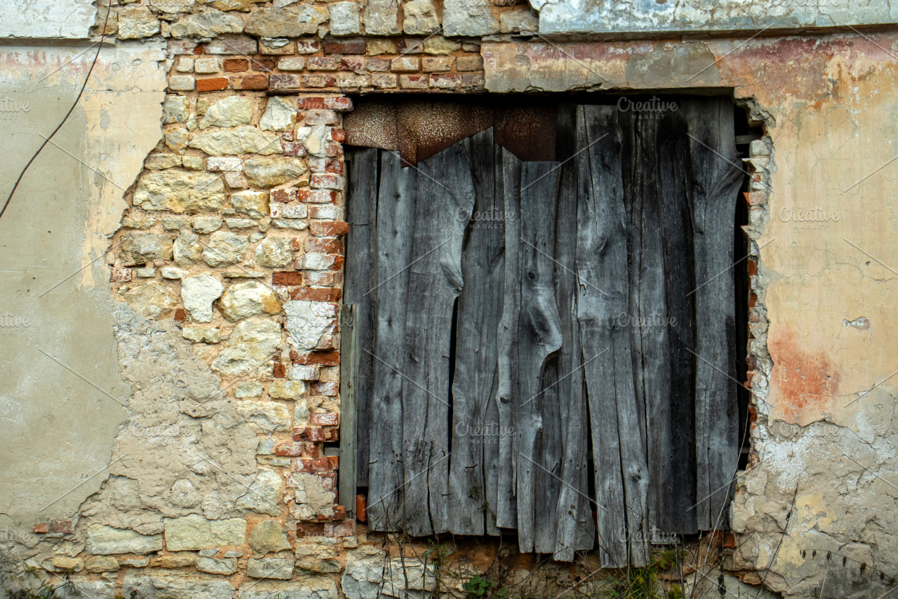 The door is blocked with old boards, an Architecture Photo by Schreibikus