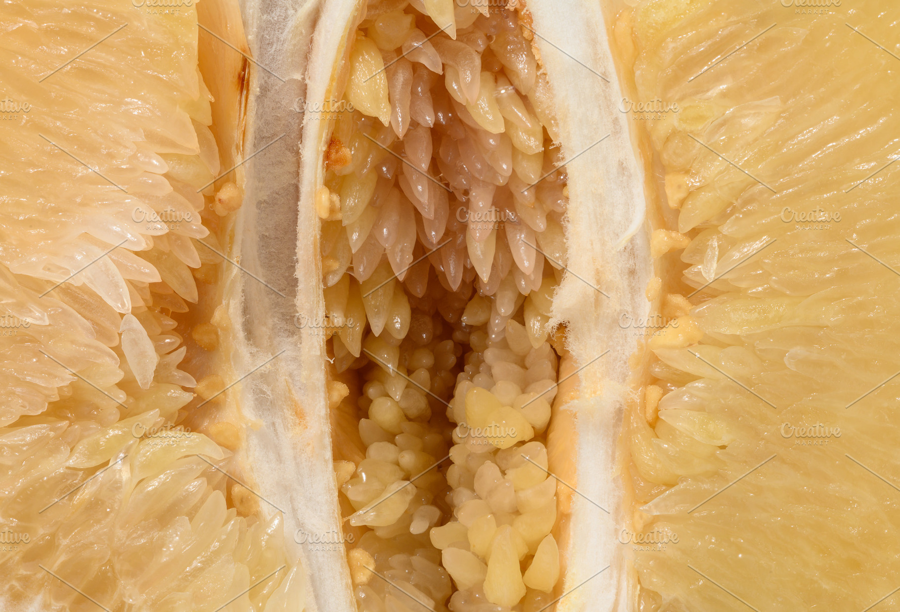 Detailed close-up of a fresh pomelo fruit, showing the juicy fl, a Food & Drink Photo by ndanko
