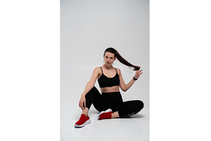 Young fitness woman in black sports, a Sports & Recreation Photo by volodymyrshtun13795