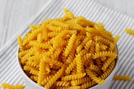 Raw Dry Organic Rotini Pasta Ready to Cook, side view., a Food & Drink Photo by LiudmylaChuhunova