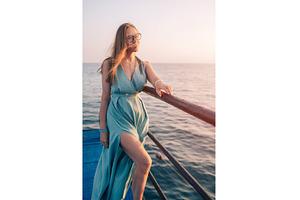 Woman in Flowing Dress on Seaside, a Person Photo by Jan Jack Russo Media