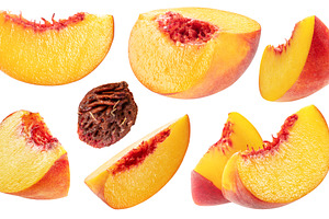 Set of ripe yellow juicy peach slices streaked with red isolated, a Food & Drink Photo by Volff