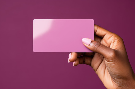 Close up of female hand holding blank business card over pink ba, a Business Photo by AS photostudio