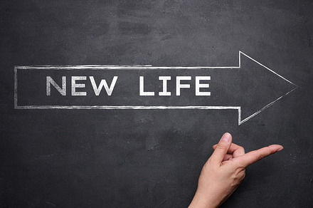 Arrow with the inscription in white chalk New life. Concept of s, a Business Photo by ndanko