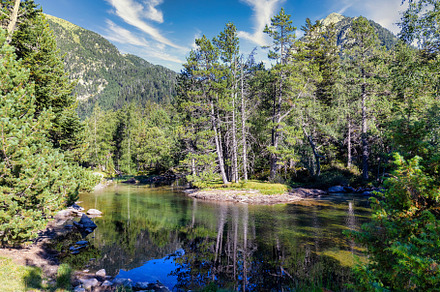 Scenic view of waterfall and lake in