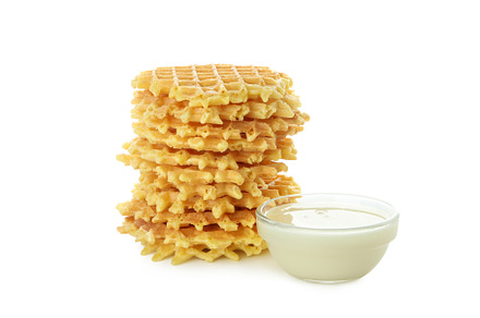 Stack of wafer and condensed milk isolated on white background, a Food & Drink Photo by AtlasStudio