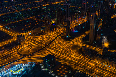 Dubai downtown night scene with city lights, an Architecture Photo by Dvoevnore photos