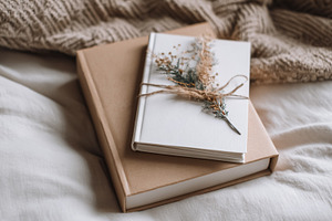 Stacked books as a thoughtful gift or present, rustic style with, a Photo by Studio ANNA