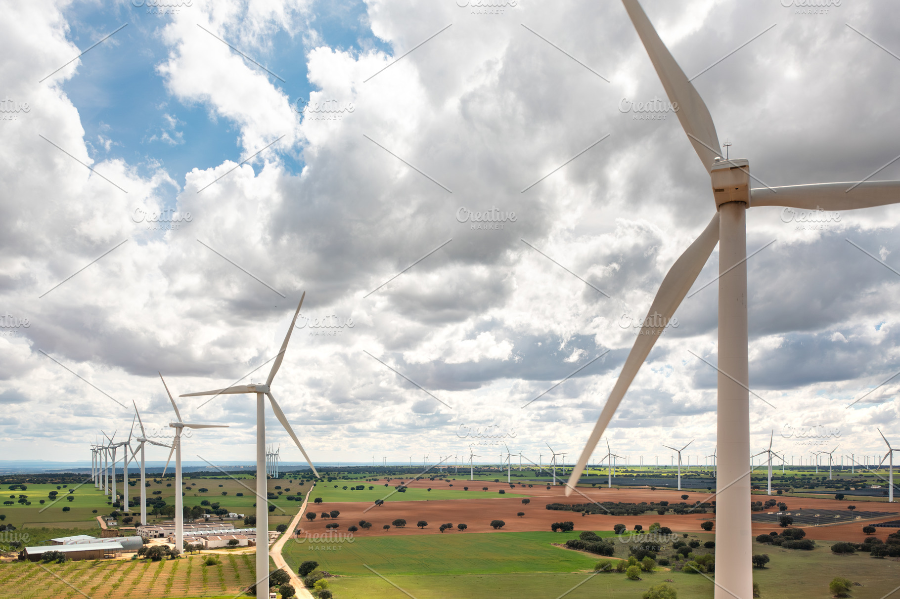 Wind turbine spinning over green farmland during daytime, a Photo by andreonegin market