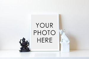 White Frame With Two Statues